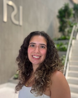 Katerina in front of a white staircase.